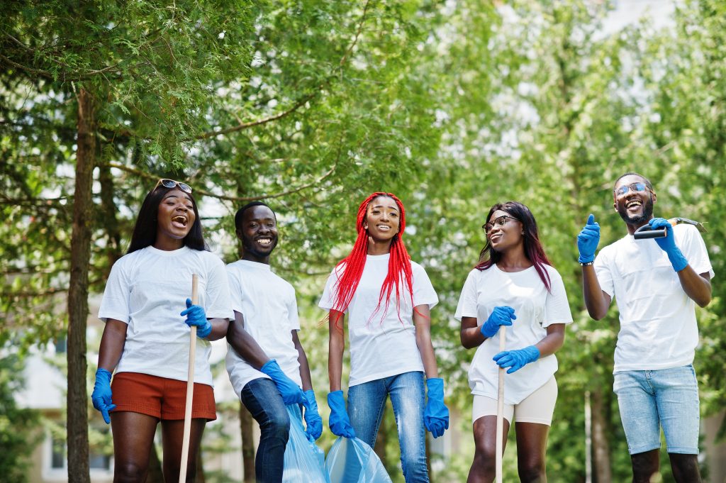 group of happy bright cleaners